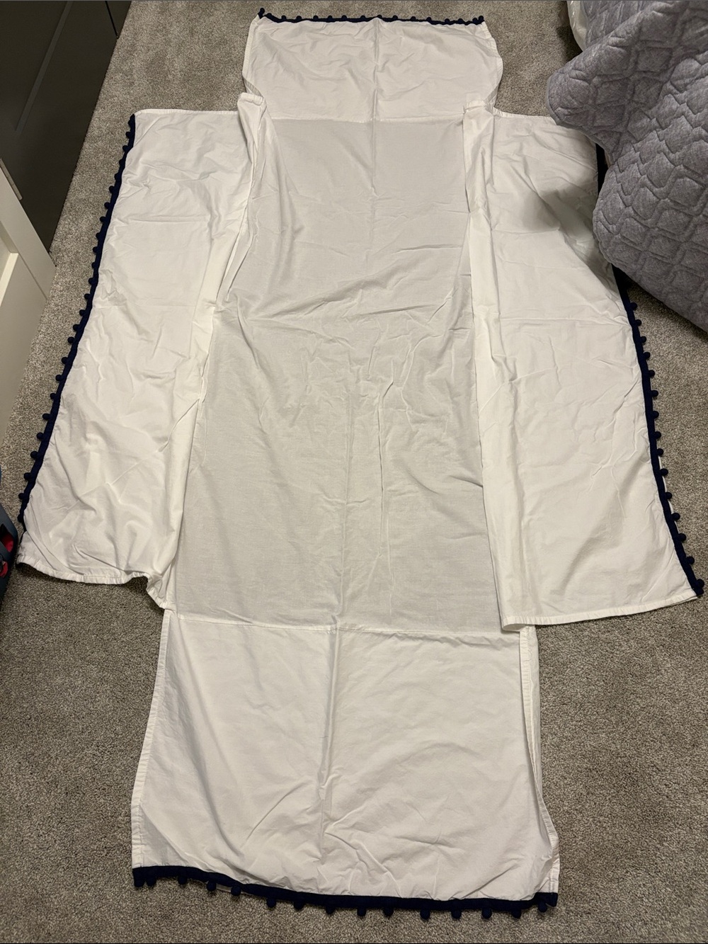Pottery Barn Kids crib skirt white and navy pom